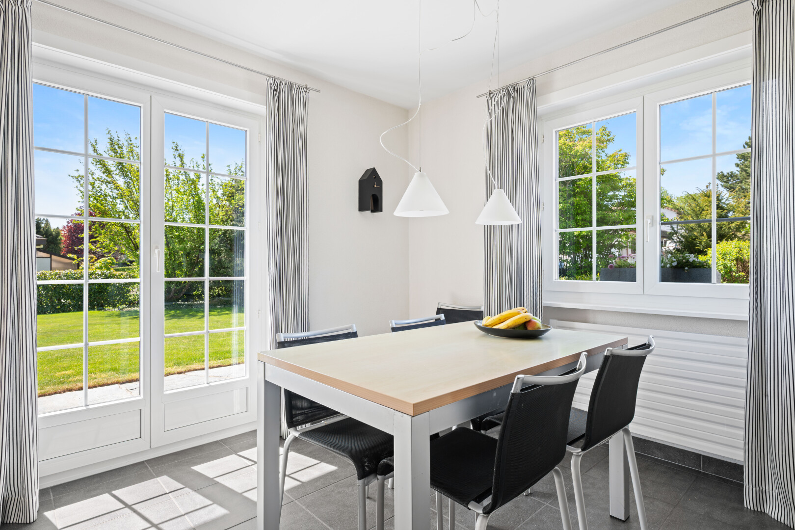tiled dining room featuring plenty of natural light
