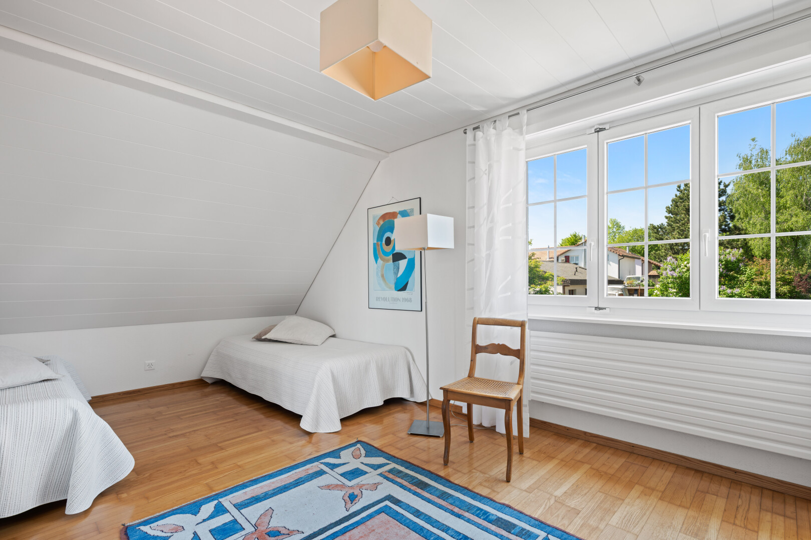 room featuring light wood-style floors and lofted ceiling