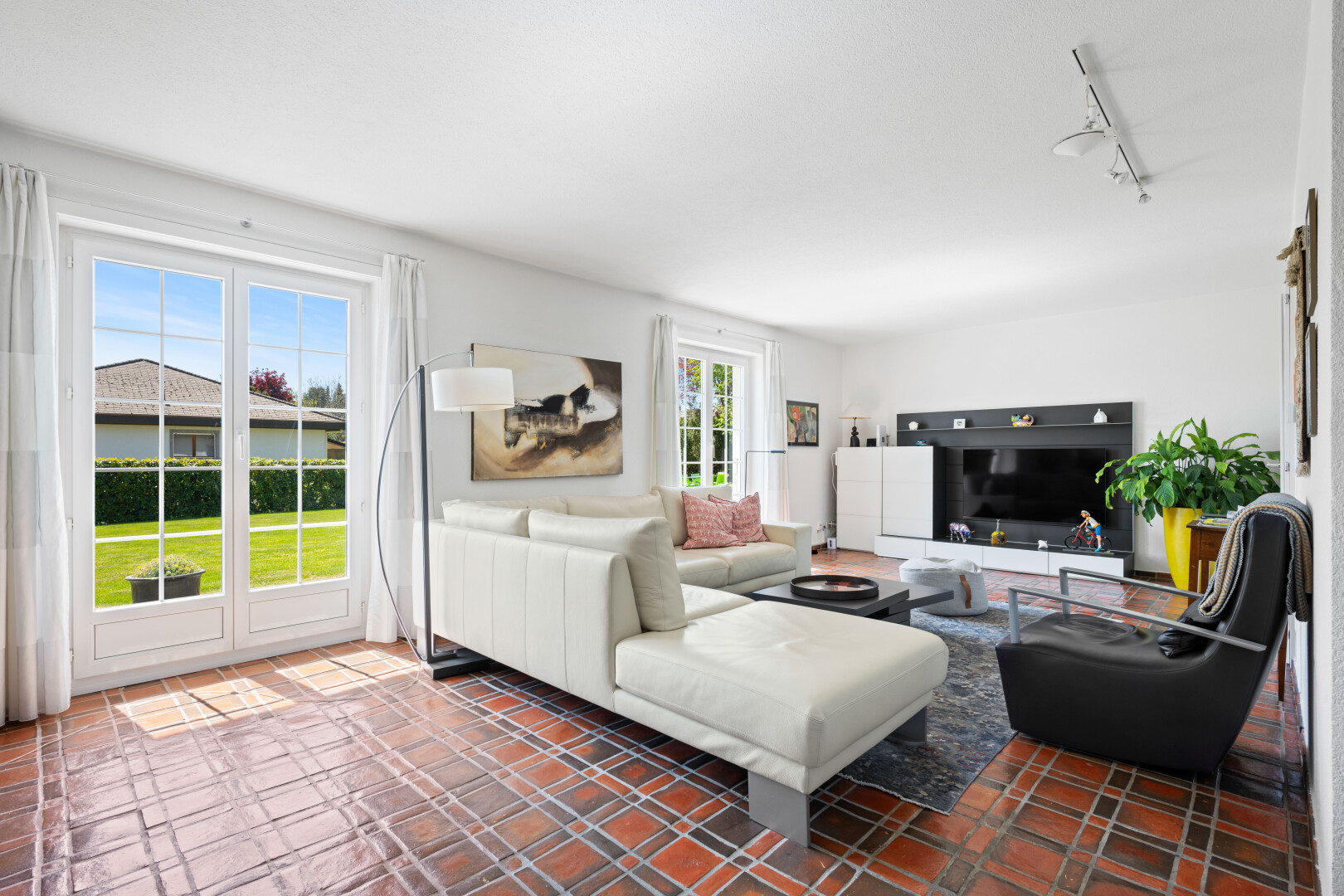 living room featuring rail lighting