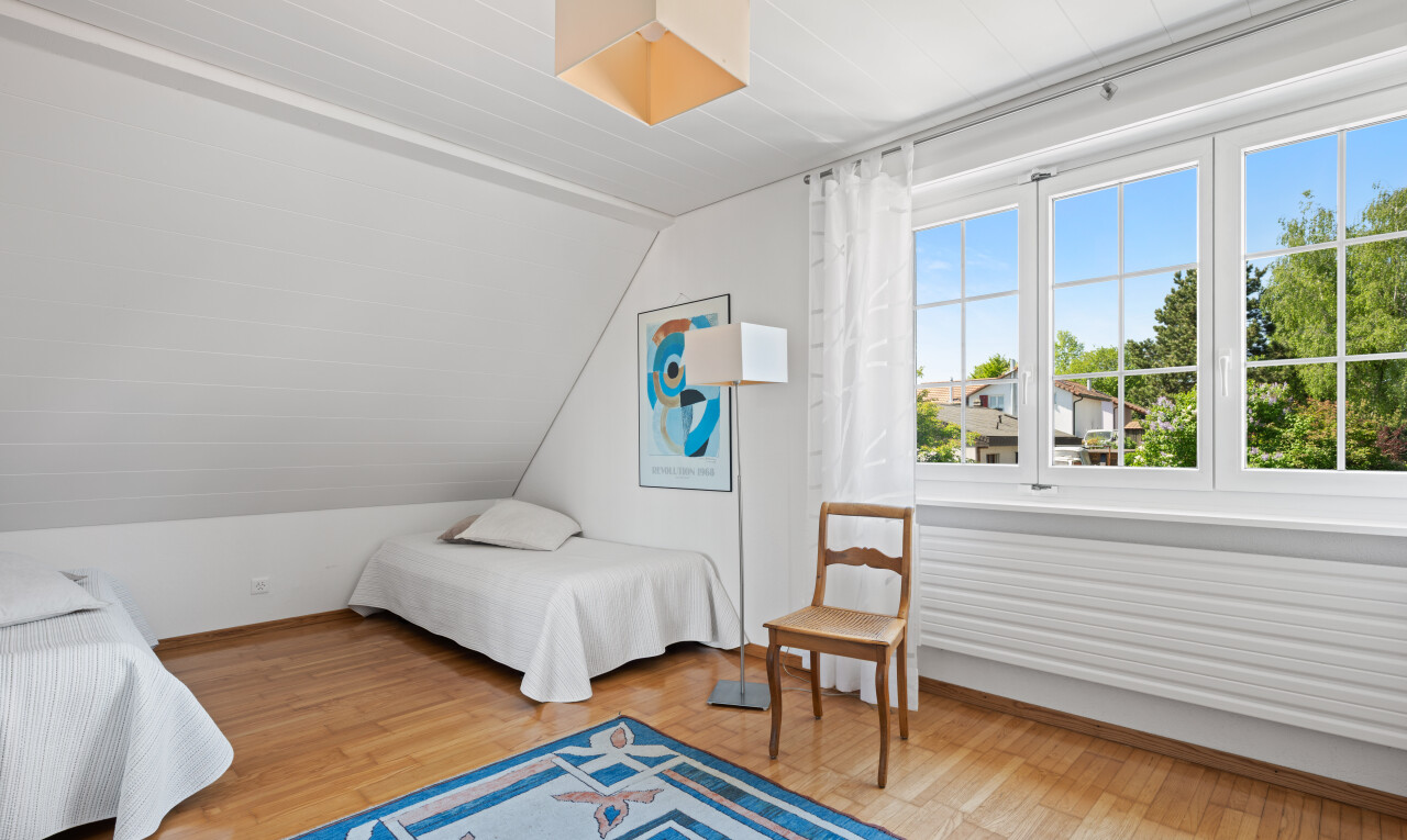 room featuring light wood-style floors and lofted ceiling