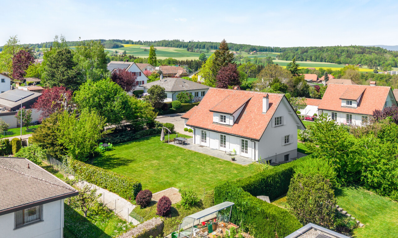 view of home featuring a residential view and a yard