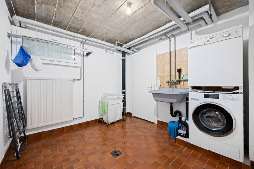 laundry area featuring stacked washing machine and dryer