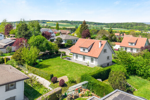 view of home featuring a residential view and a yard
