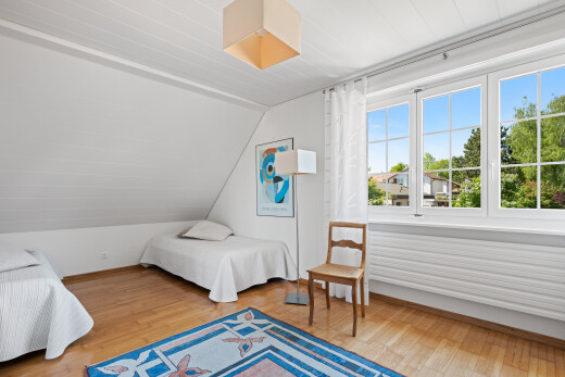 room featuring light wood-style floors and lofted ceiling