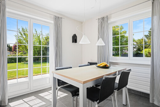 tiled dining room featuring plenty of natural light