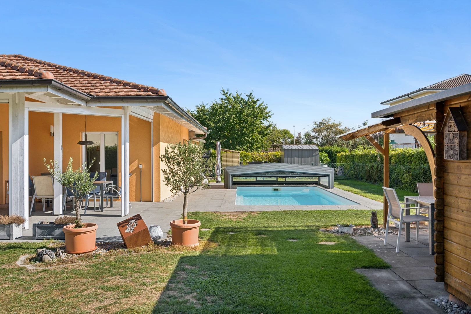 schwimmbad mit schwimmbad, essbereich im freien, terrasse, rasen, und from property