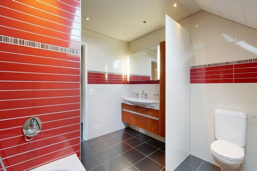 full bath featuring vanity and tile walls