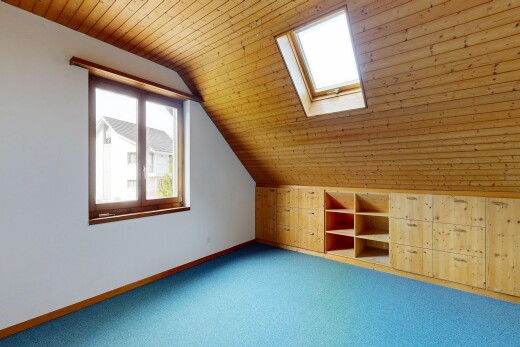 empty room with a vaulted wood ceiling, carpet floors, and a skylight