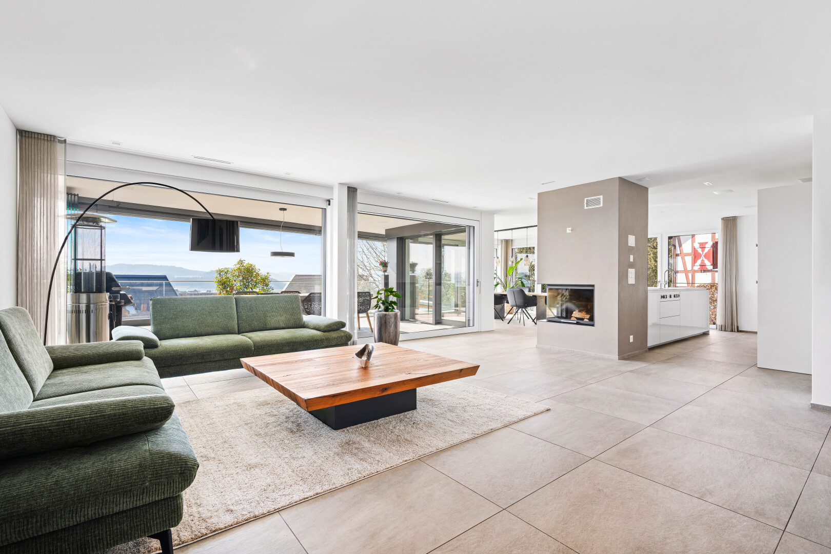 living room featuring concrete floors and a fireplace