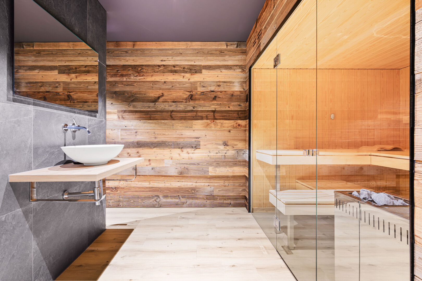 bathroom with wooden walls, vanity, wood finished floors, and a sauna / steam room