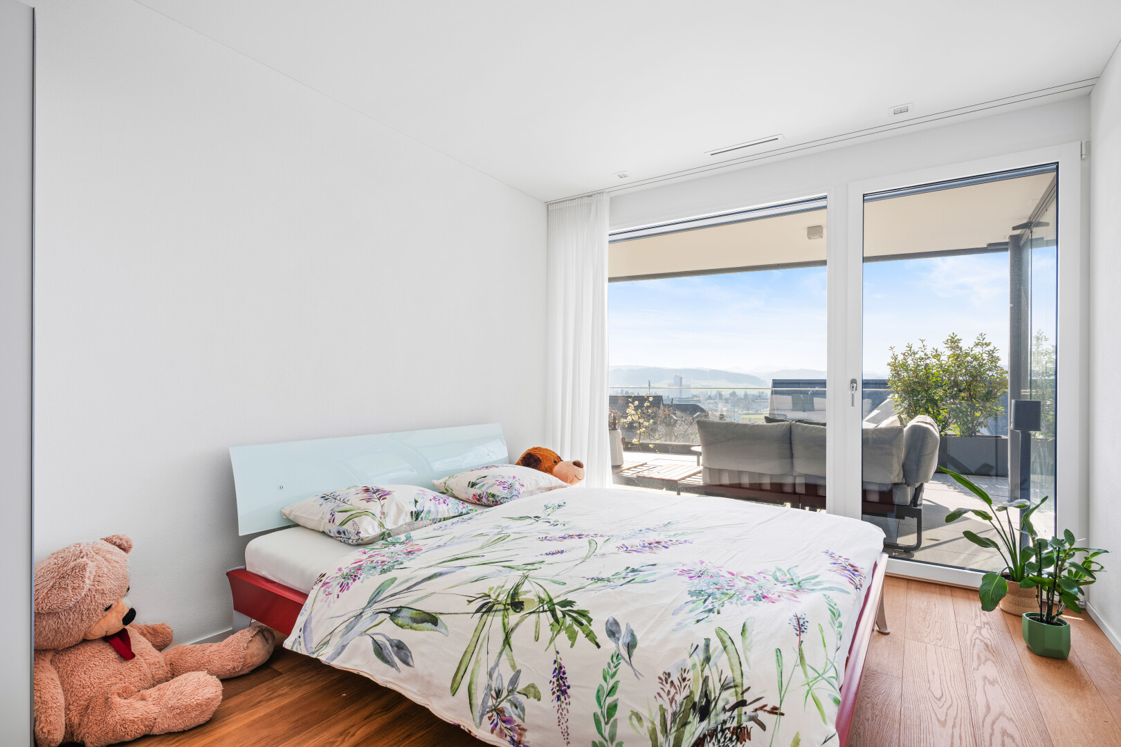 room / bedroom with wood finished floors and access to exterior