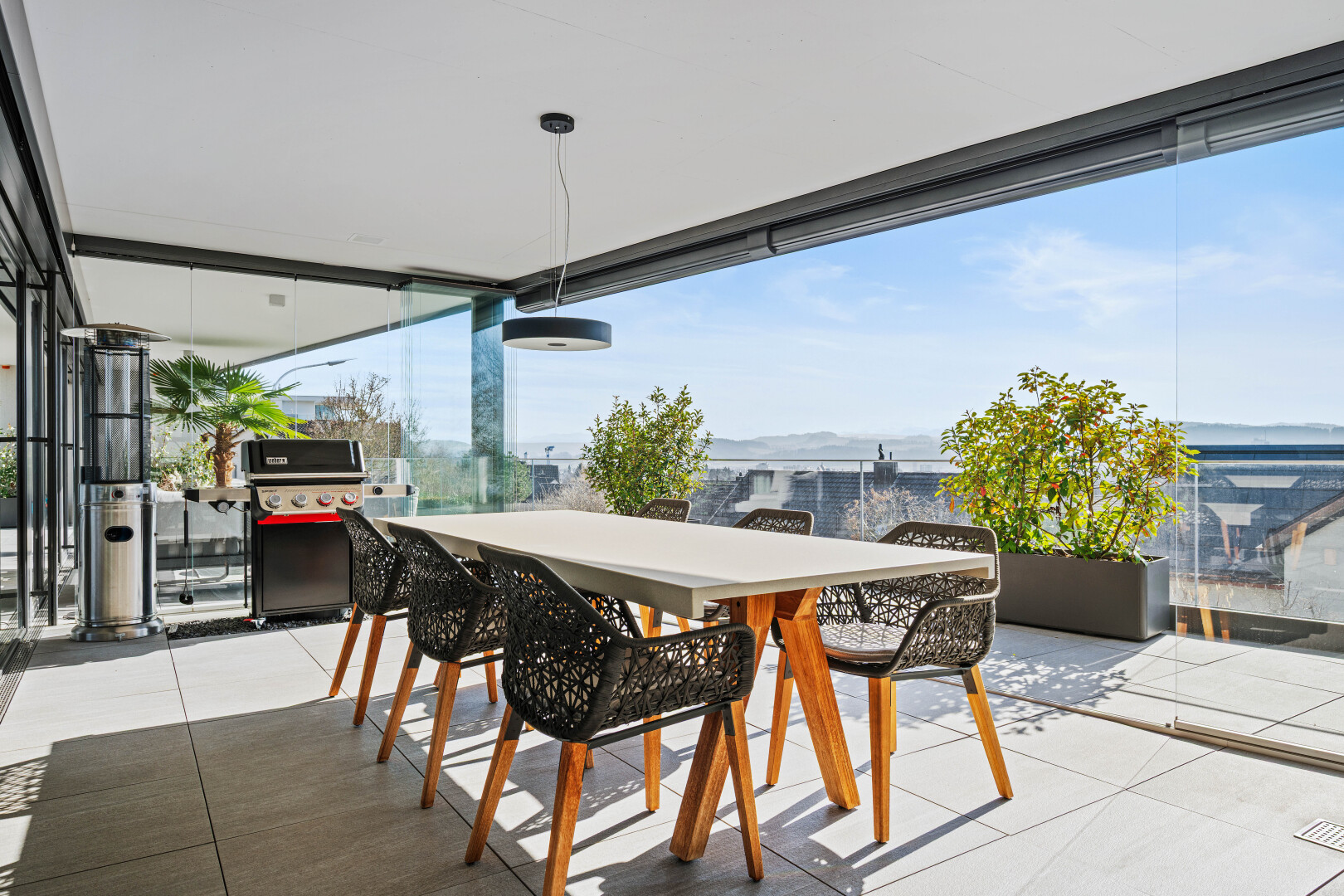patio / terrace with outdoor dining space, a grill, and a patio area