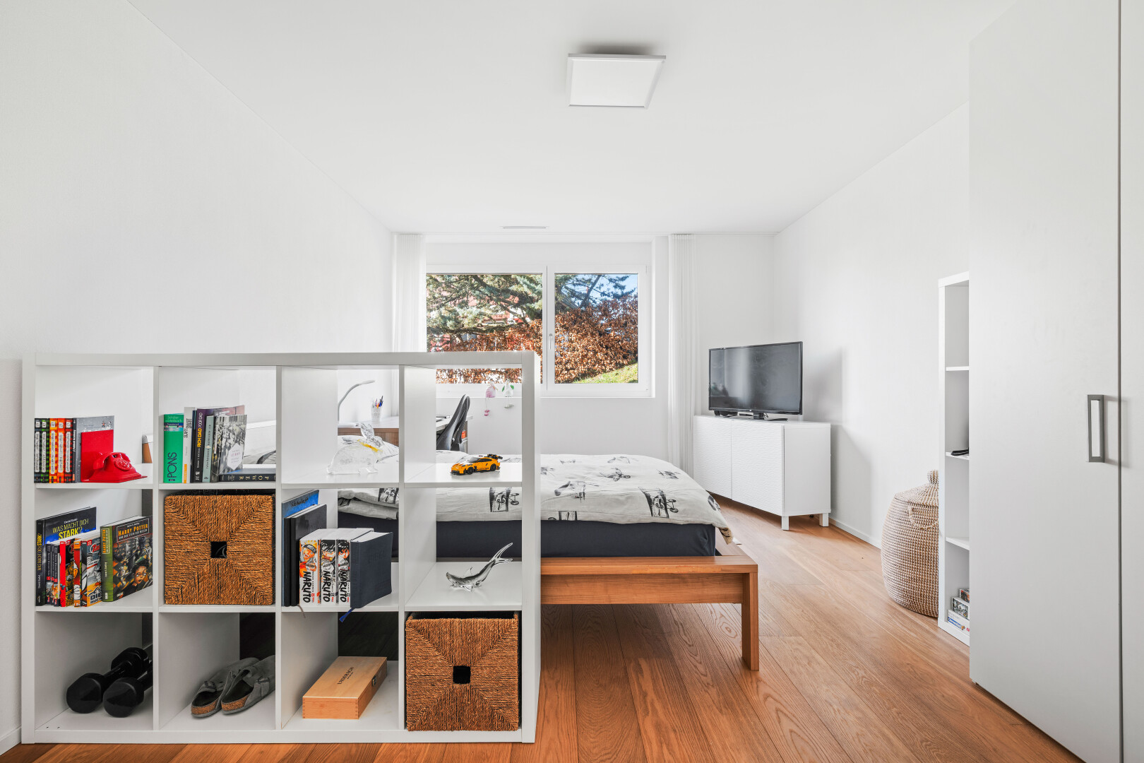 room / bedroom with light wood finished floors