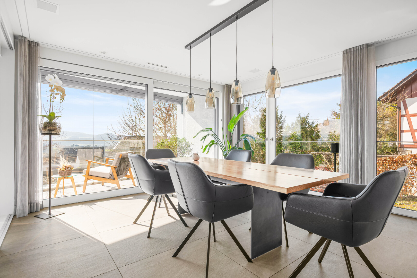 dining space featuring light tile patterned flooring