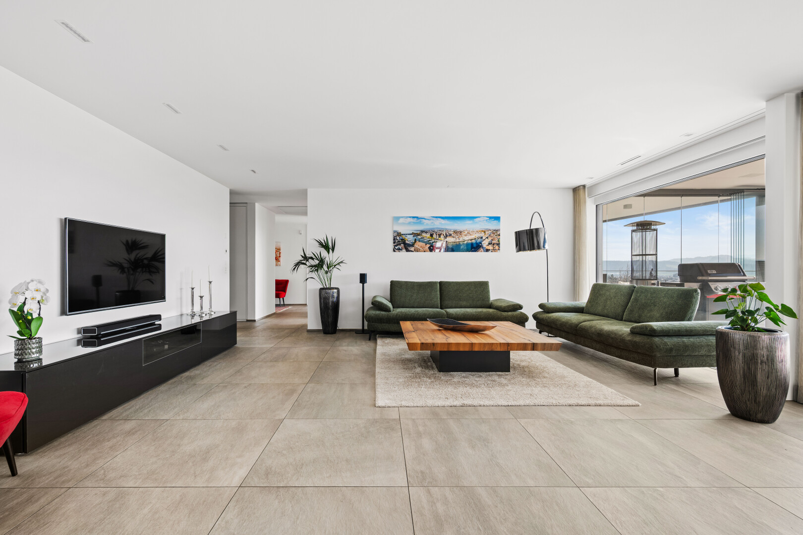 living room featuring concrete flooring and floor to ceiling windows
