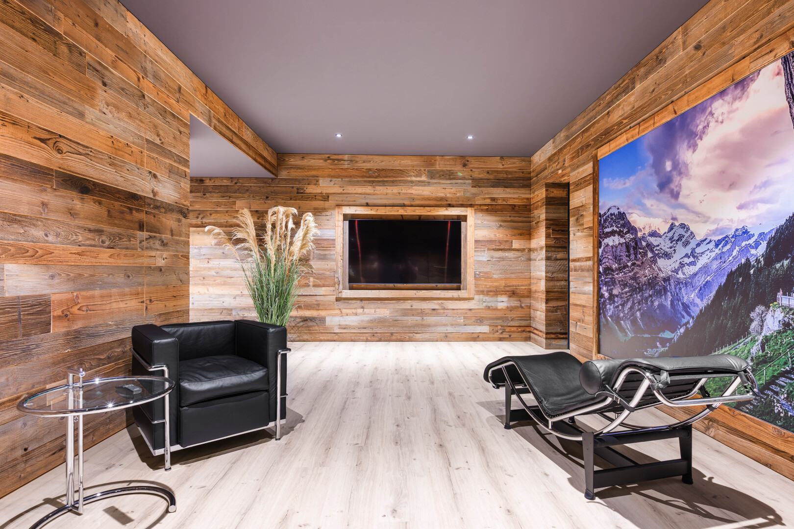 workout area with wood walls, wood finished floors, and a mountain view