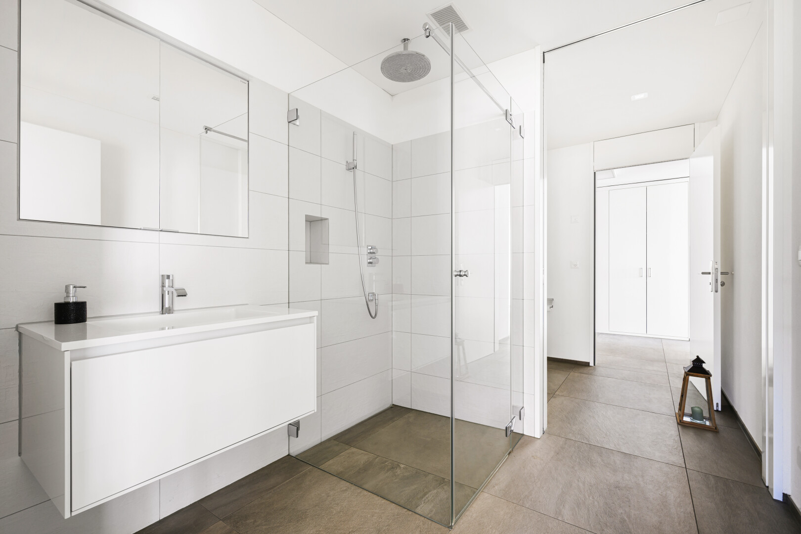 bathroom with vanity and a stall shower