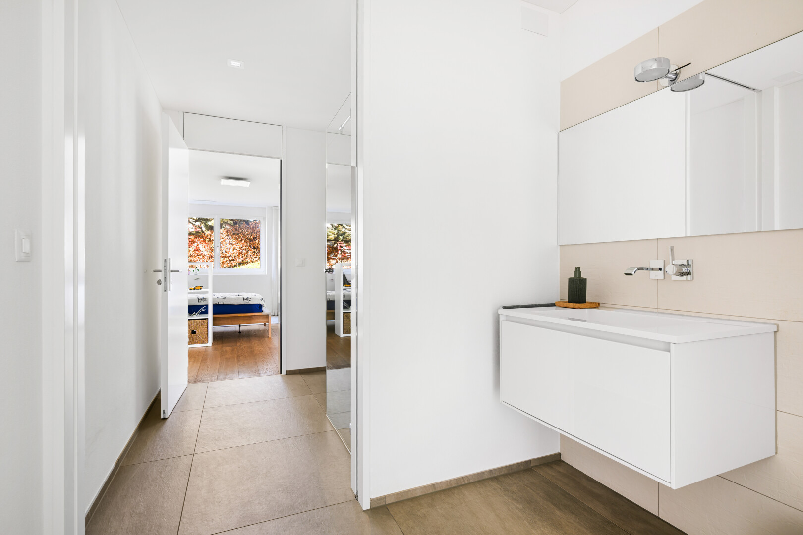 bathroom with vanity and light wood-style floors