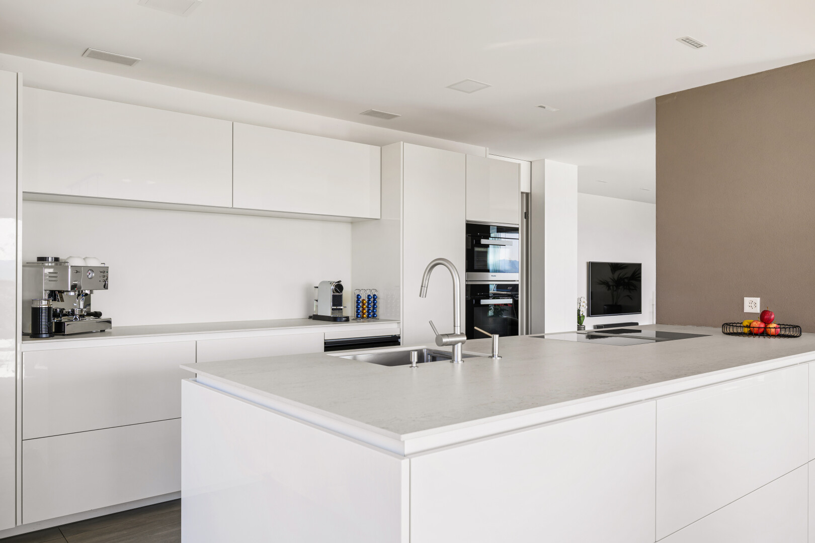 kitchen featuring modern cabinets and white cabinets