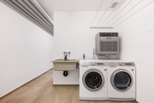 laundry area featuring separate washer and dryer and a wall mounted air conditioner