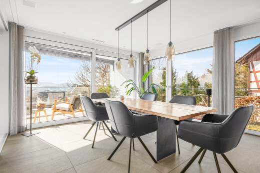 dining space featuring light tile patterned flooring