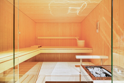 unfurnished room with a relaxing sauna, wooden walls, and wood ceiling
