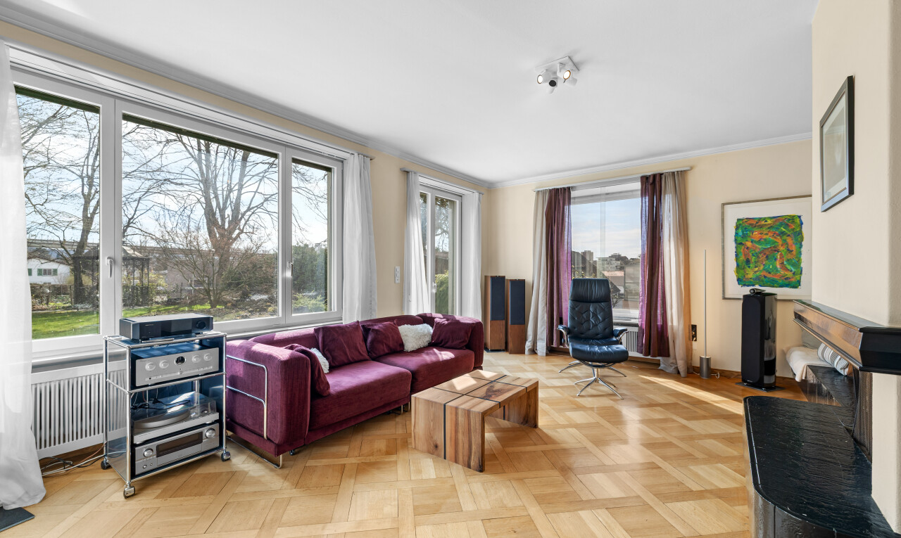 living room with parquet flooring and radiator