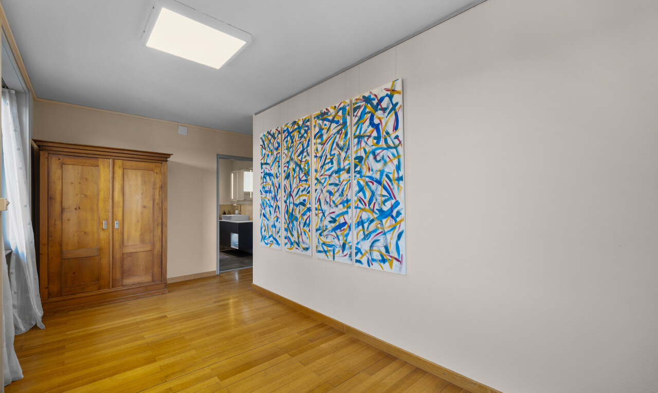 empty room with light wood-type flooring and baseboards