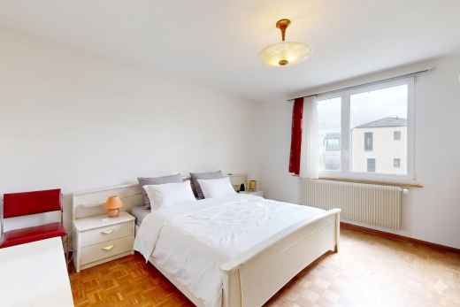 chambre avec parquet floor, sol en finition bois, wood finish floor, radiateur, et inside property