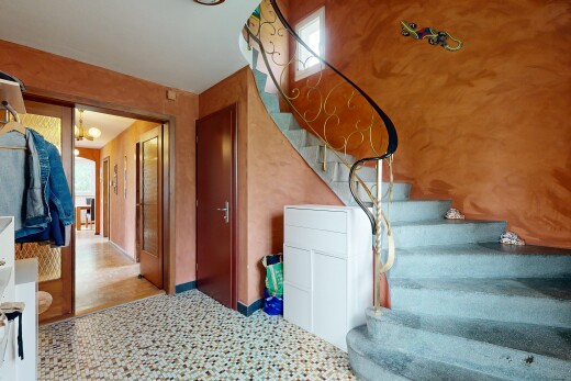 stairway featuring baseboards