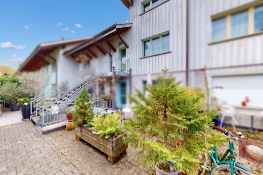 outdoor house featuring stairs and a garden