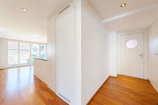 corridor featuring light wood-style flooring and recessed lighting