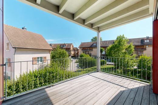 view of wooden terrace featuring a residential view