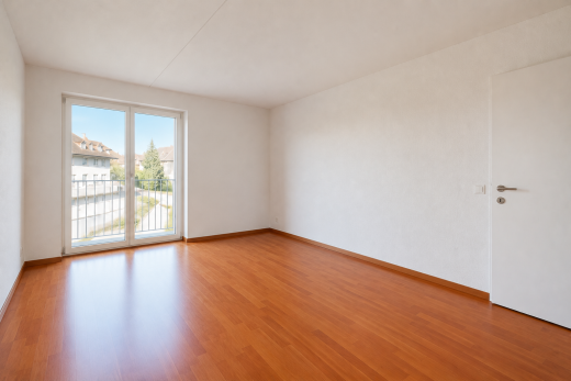 unfurnished room featuring wood finished floors and baseboards