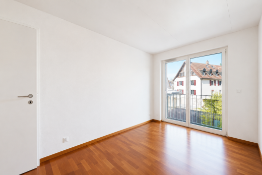 unfurnished room featuring wood finished floors and baseboards