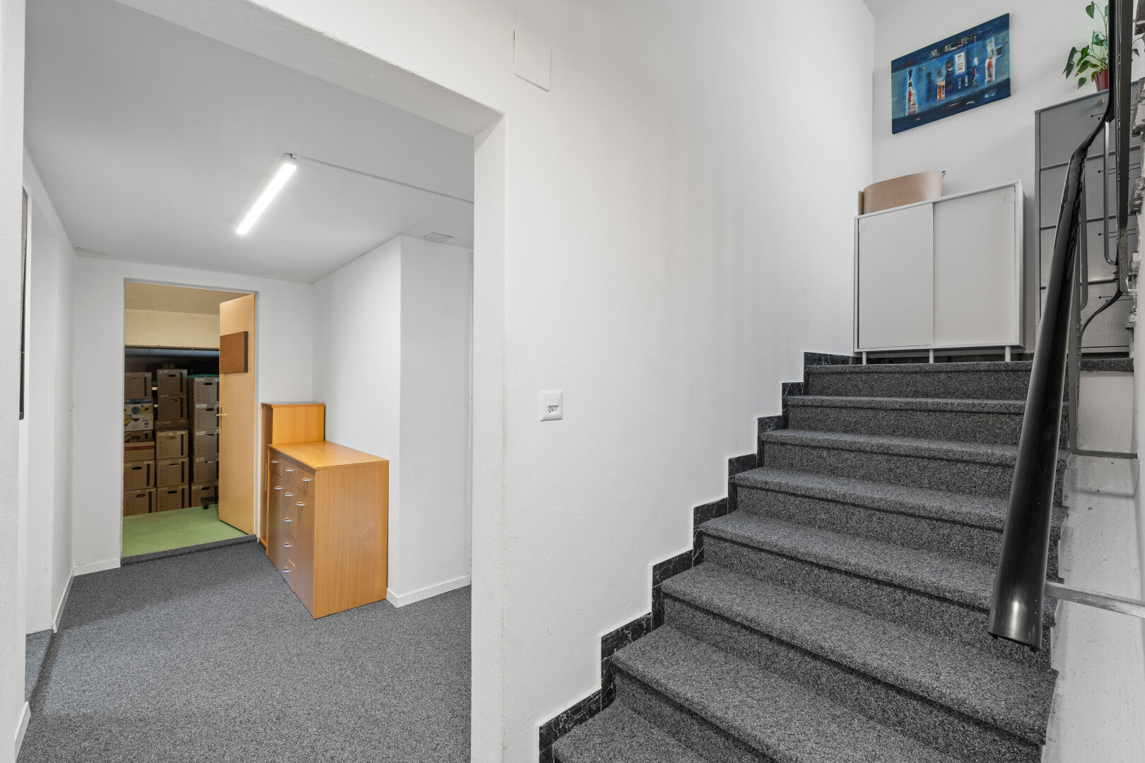 stairway with carpet flooring and baseboards