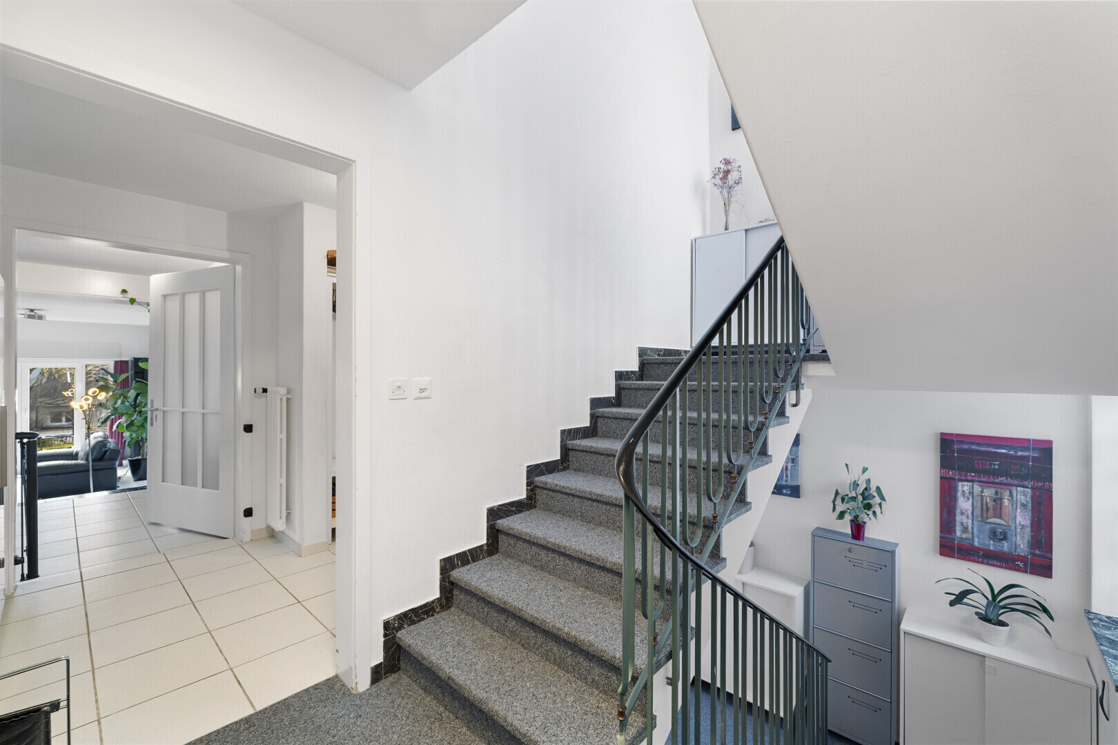 stairway featuring tile patterned floors