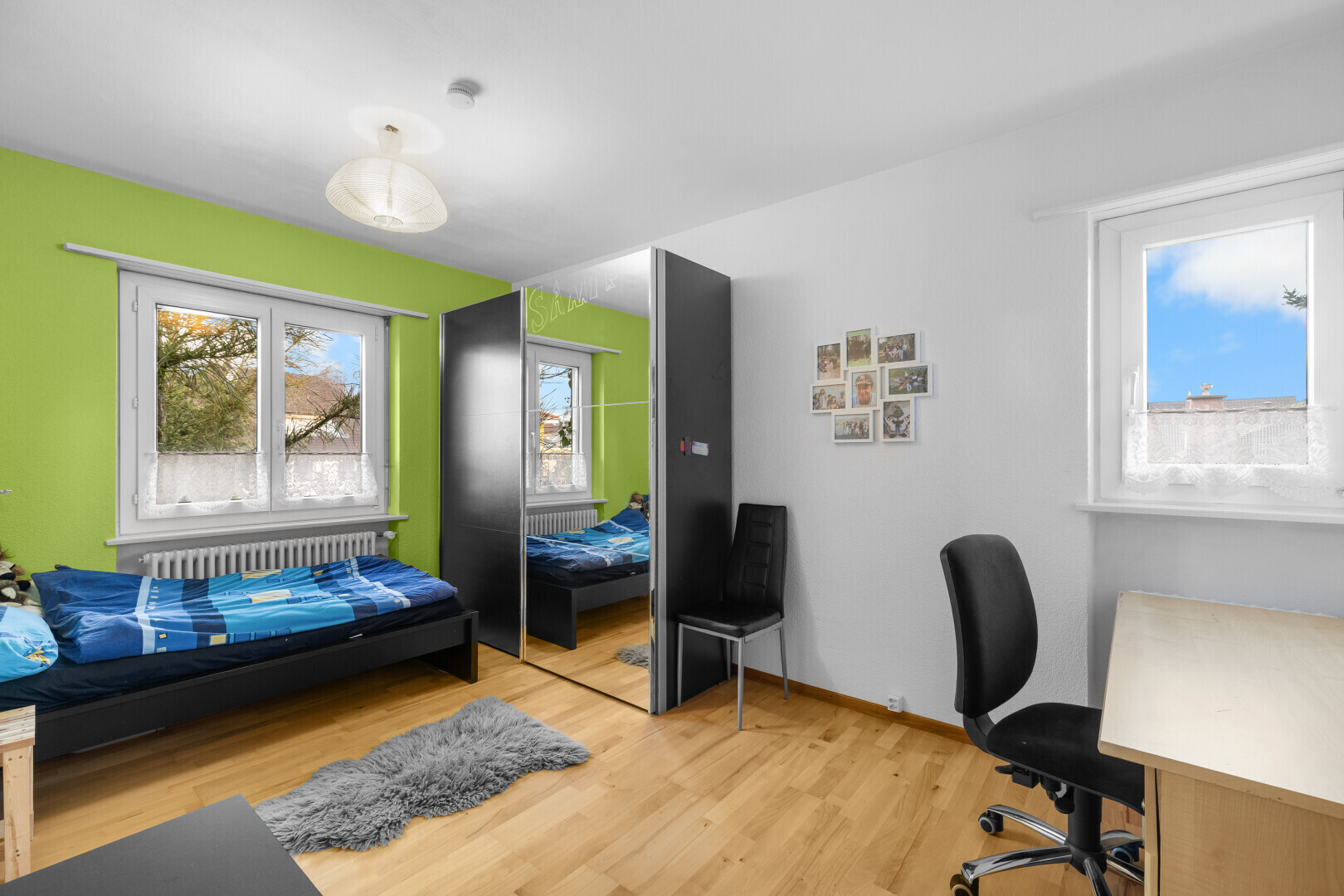 office featuring light wood-style floors and radiator
