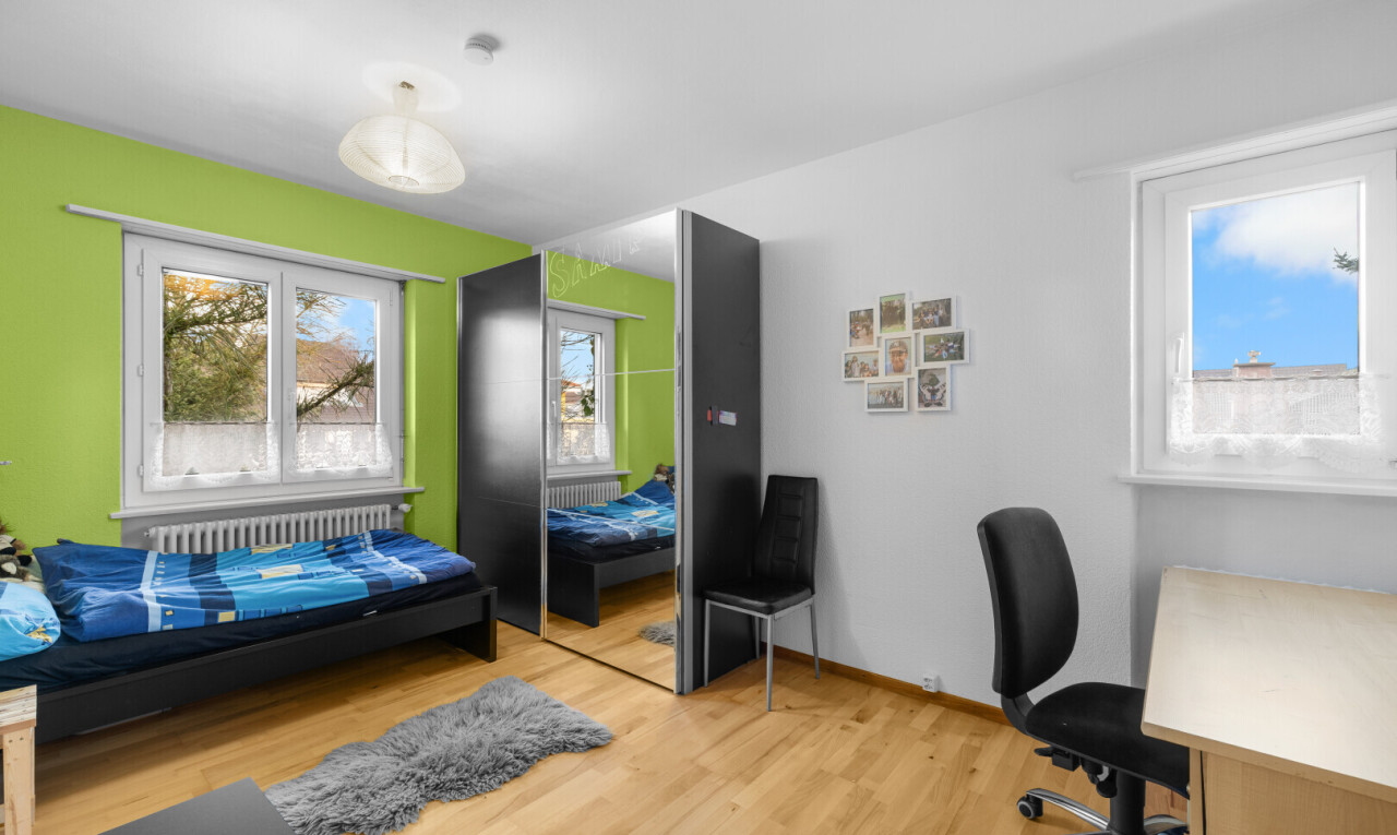office featuring light wood-style floors and radiator