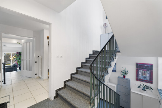 stairway featuring tile patterned floors