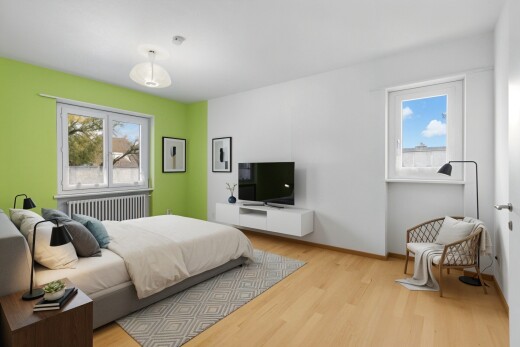 room / bedroom featuring radiator heating unit and wood finished floors