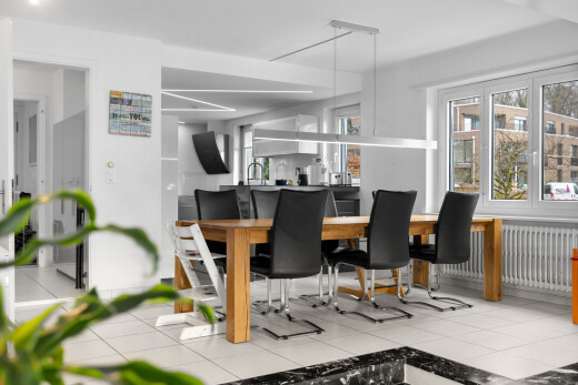 dining area featuring light tile patterned floors, radiator, and track lighting