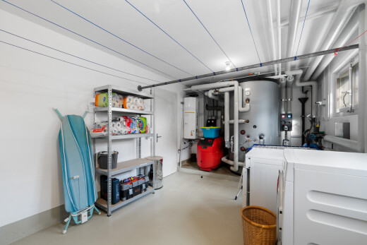 view of parking with water heater
