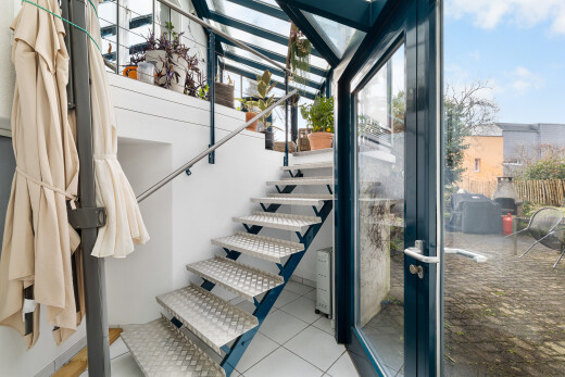 staircase with tile patterned flooring