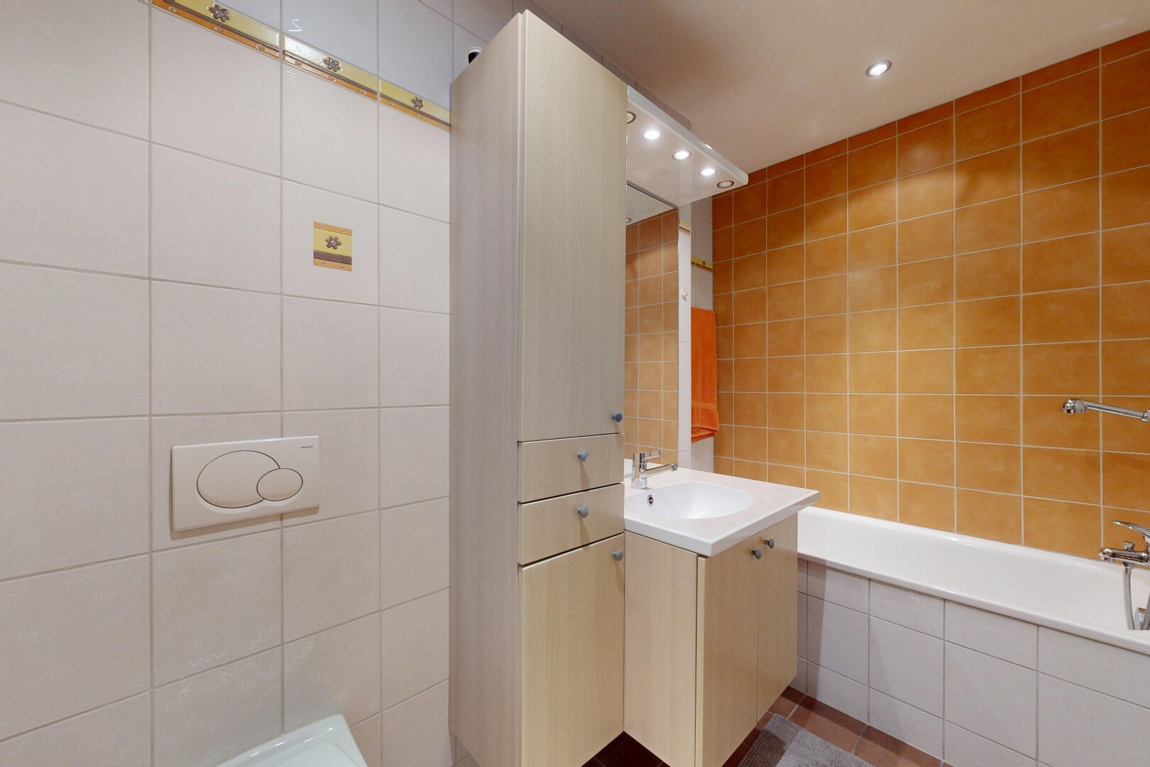 full bathroom featuring vanity, recessed lighting, tile walls, and tiled bath