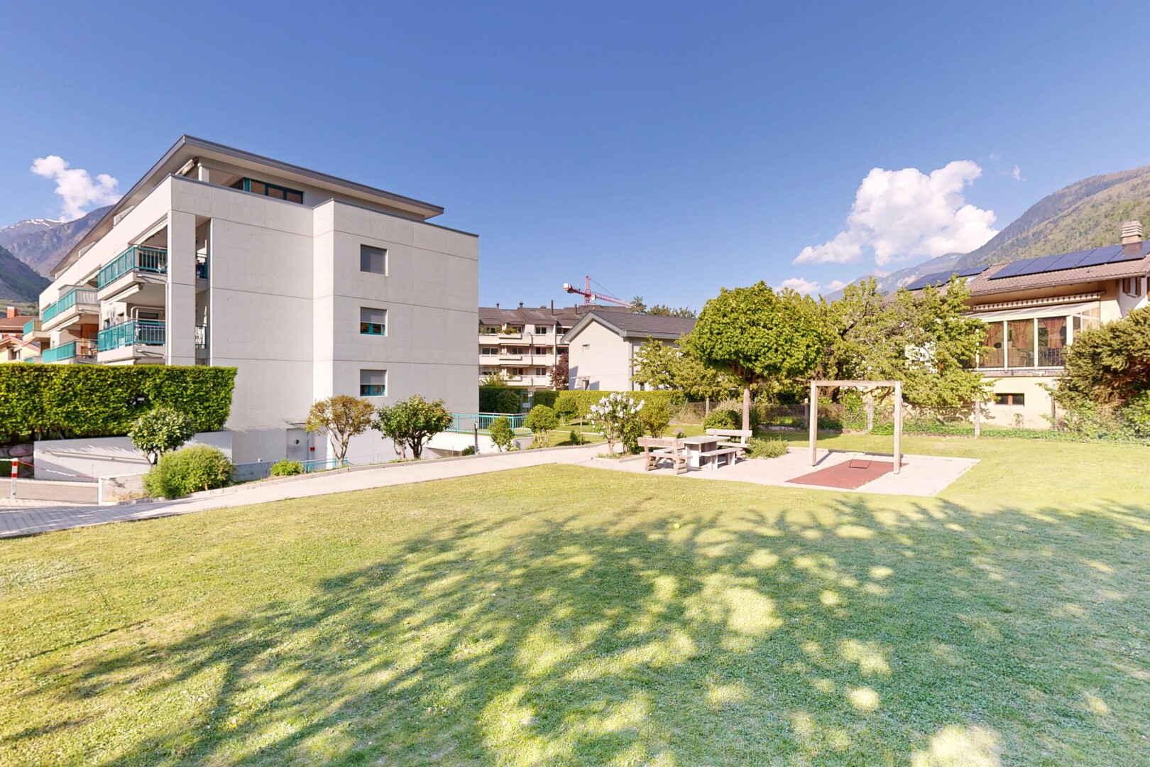 view of home featuring a lawn, a mountain view, and stucco siding