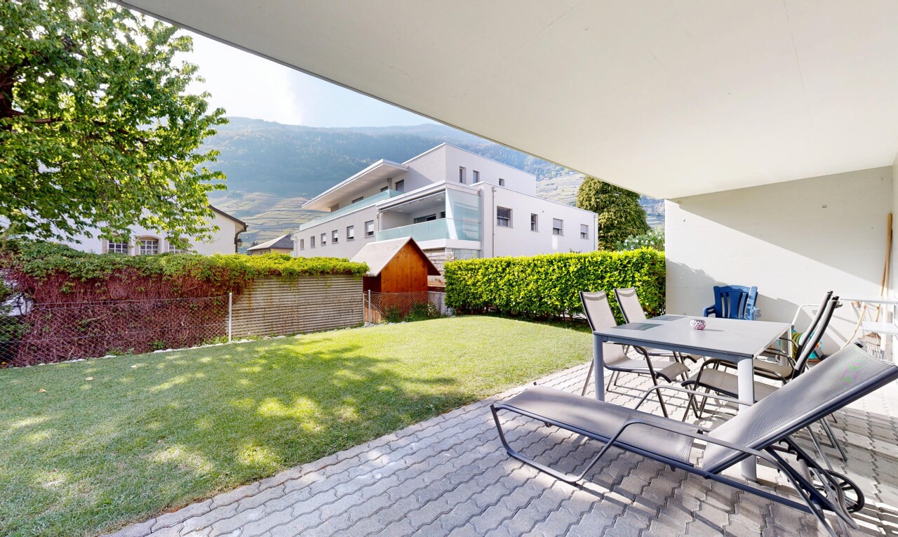 terrace featuring outdoor dining space, a mountain view, a patio area, and a fenced backyard