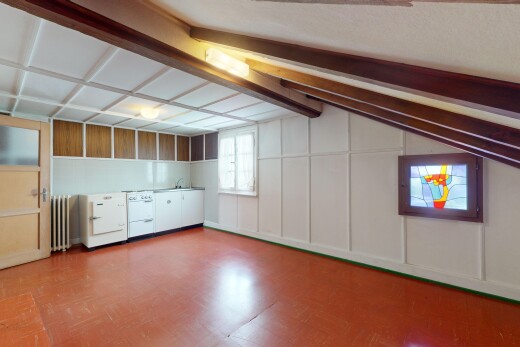 unfurnished room with lofted ceiling and radiator