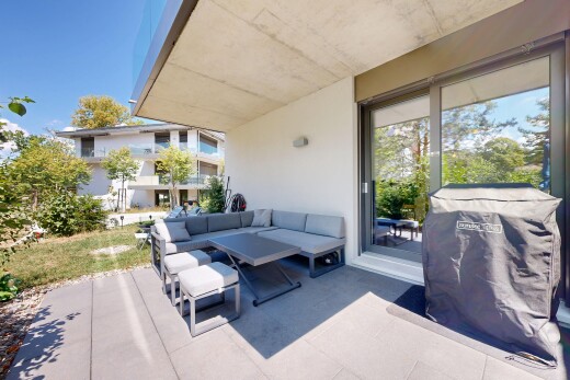 terrace featuring a grill, outdoor seating, and a patio area