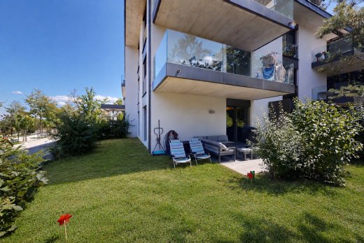 view of property featuring a yard, a patio area, outdoor seating, and stucco siding